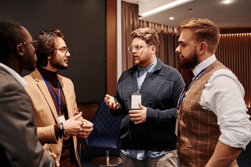 Four men discussing about PR
